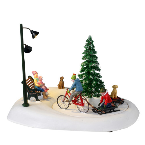 Scène Faire du vélo avec papa pour village de Noël