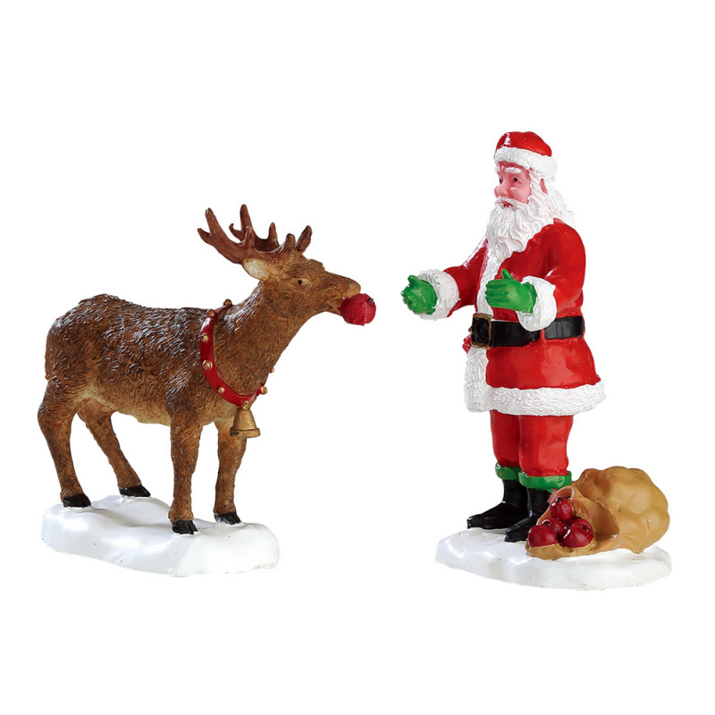 Figurines : Nourrir un renne avec le père Noël - H